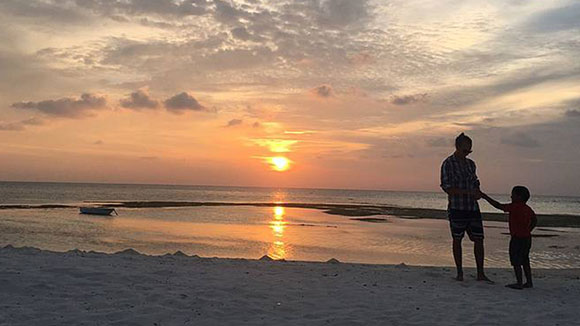 Scenic photo of sunset over a beach