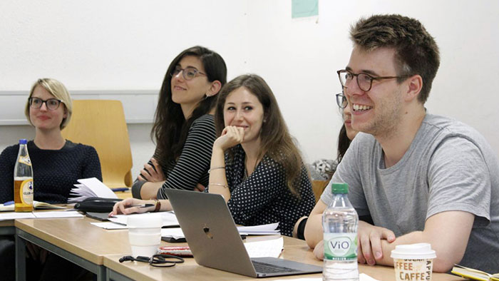 Doctoral students listen closely to Michael Taussig’s explanations.