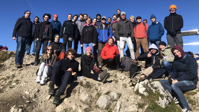 Group picture of students on a mountain summit.