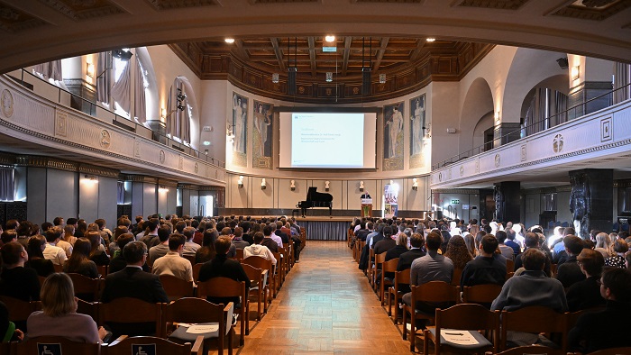 The auditorium with a long alley and chairs