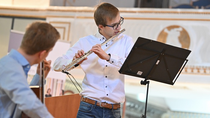 Two musicians performing on a stage