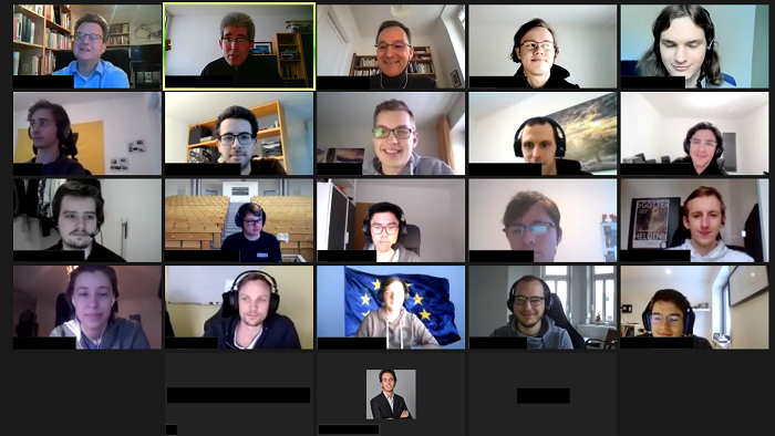The faces of people participating in an online conference.