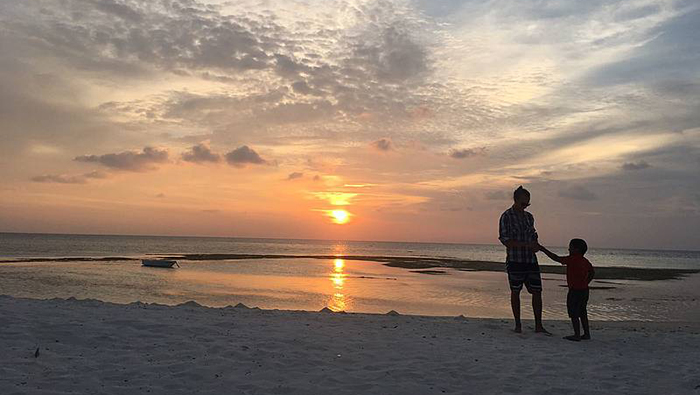 Scenic photo of sunset over a beach