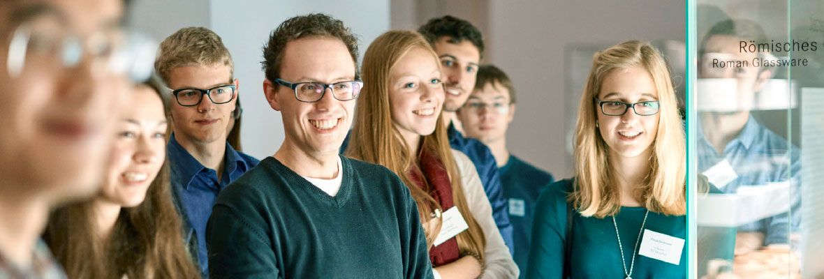 A group of students who have received scholarships through the Max Weber Program look towards the camera and smile.