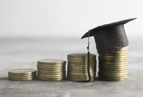 Several stacks of coins are placed on a surface. They are arranged in height order. A mortarboard is on top of the final stack of coins.